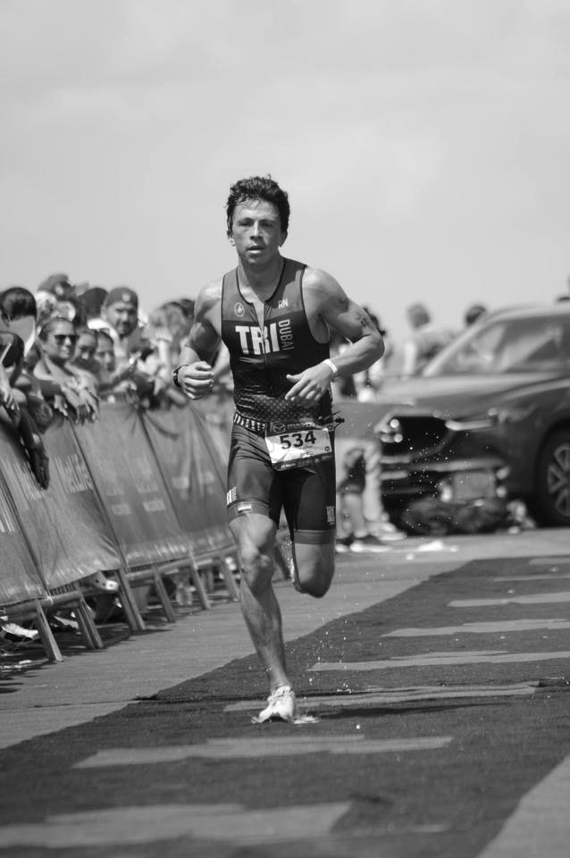 Rodrigo finishing a triathlon